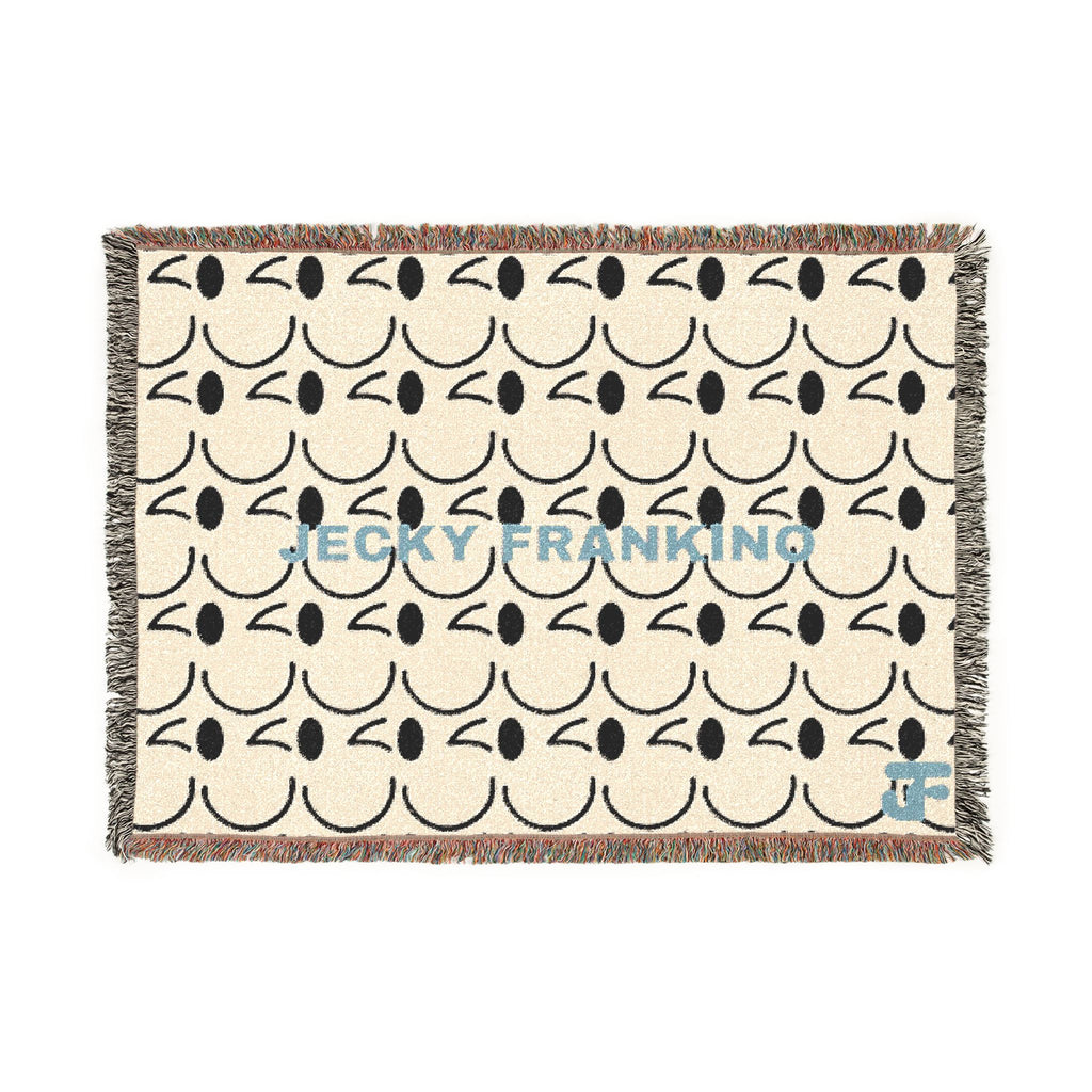 Smiling JECKY FRANKINO Face Woven Blanket | Repeating Skull Design, Neutral Tones