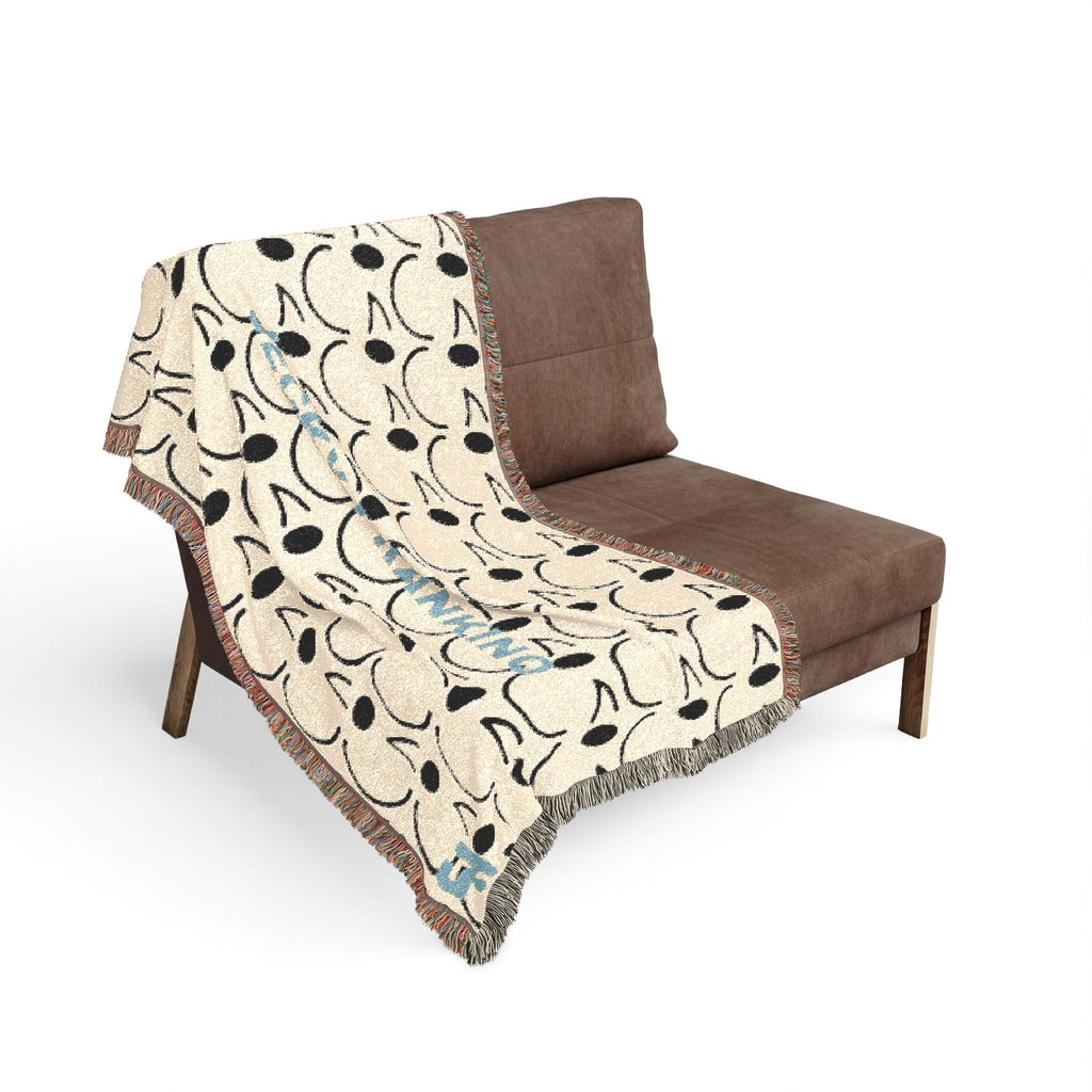 Smiling JECKY FRANKINO Face Woven Blanket | Repeating Skull Design, Neutral Tones